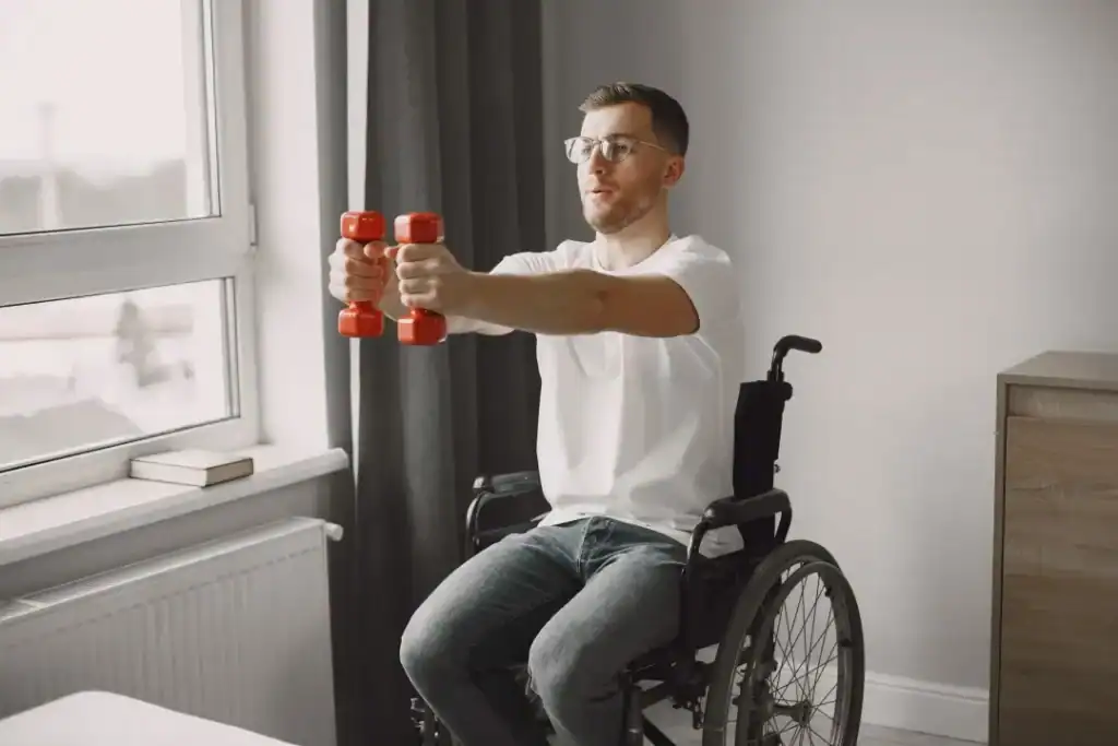 Image of man doing exercise in his wheelchair to aid weight loss Hampshire