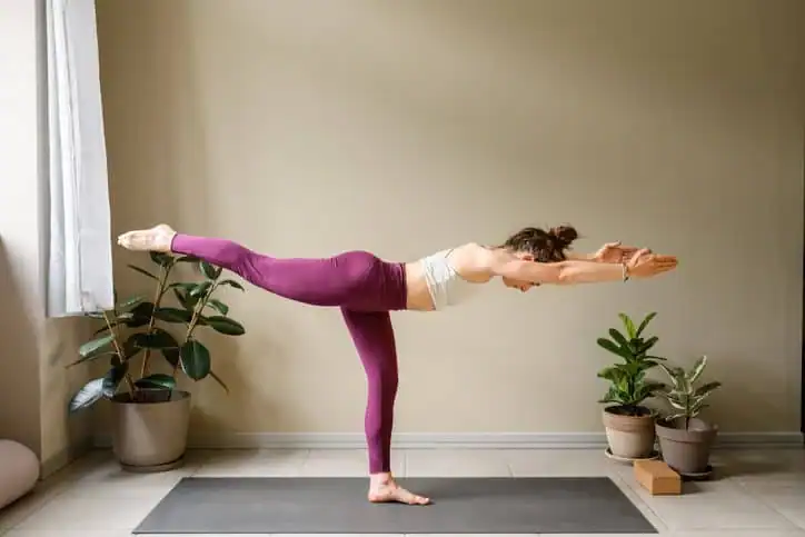 Woman doing Yoga exercise Hampshire to help with toning the body. 